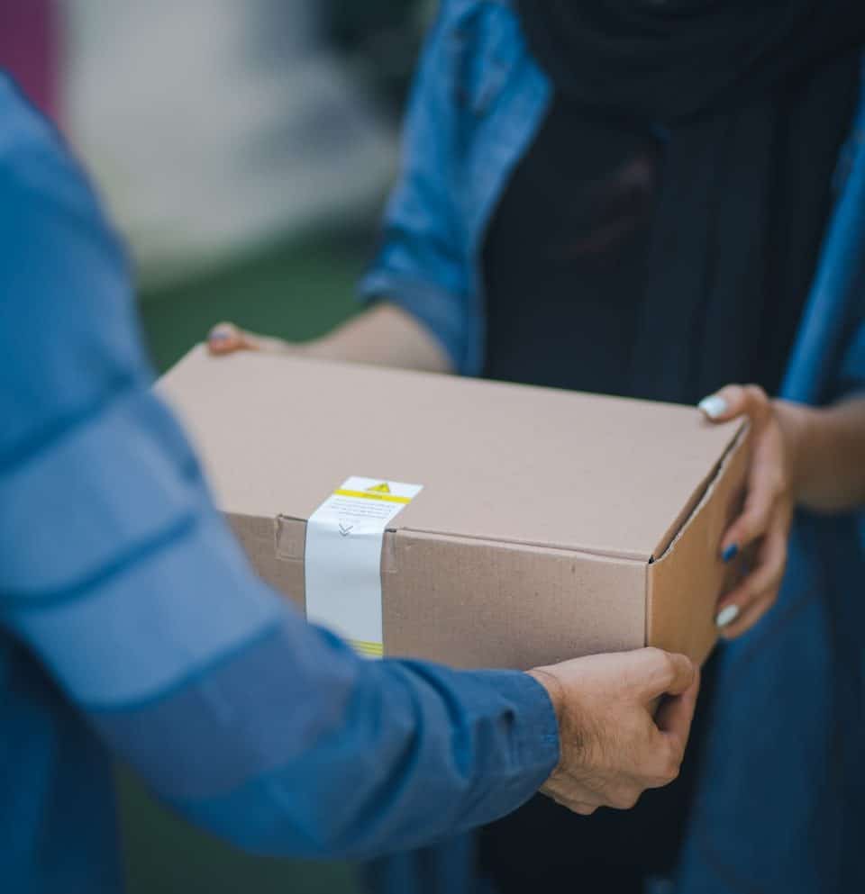person giving brown box