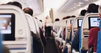 shallow focus photography of people inside of passenger plane