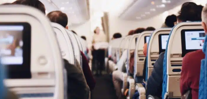 shallow focus photography of people inside of passenger plane